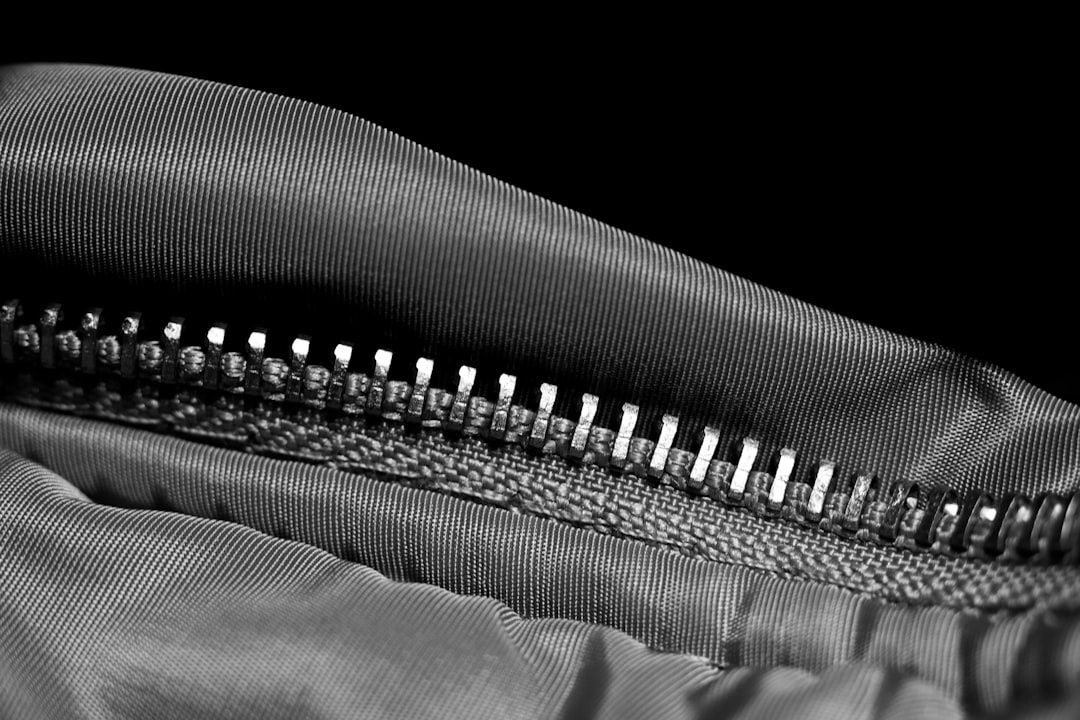 Close-up of gritty backpack fabric and zipper teeth